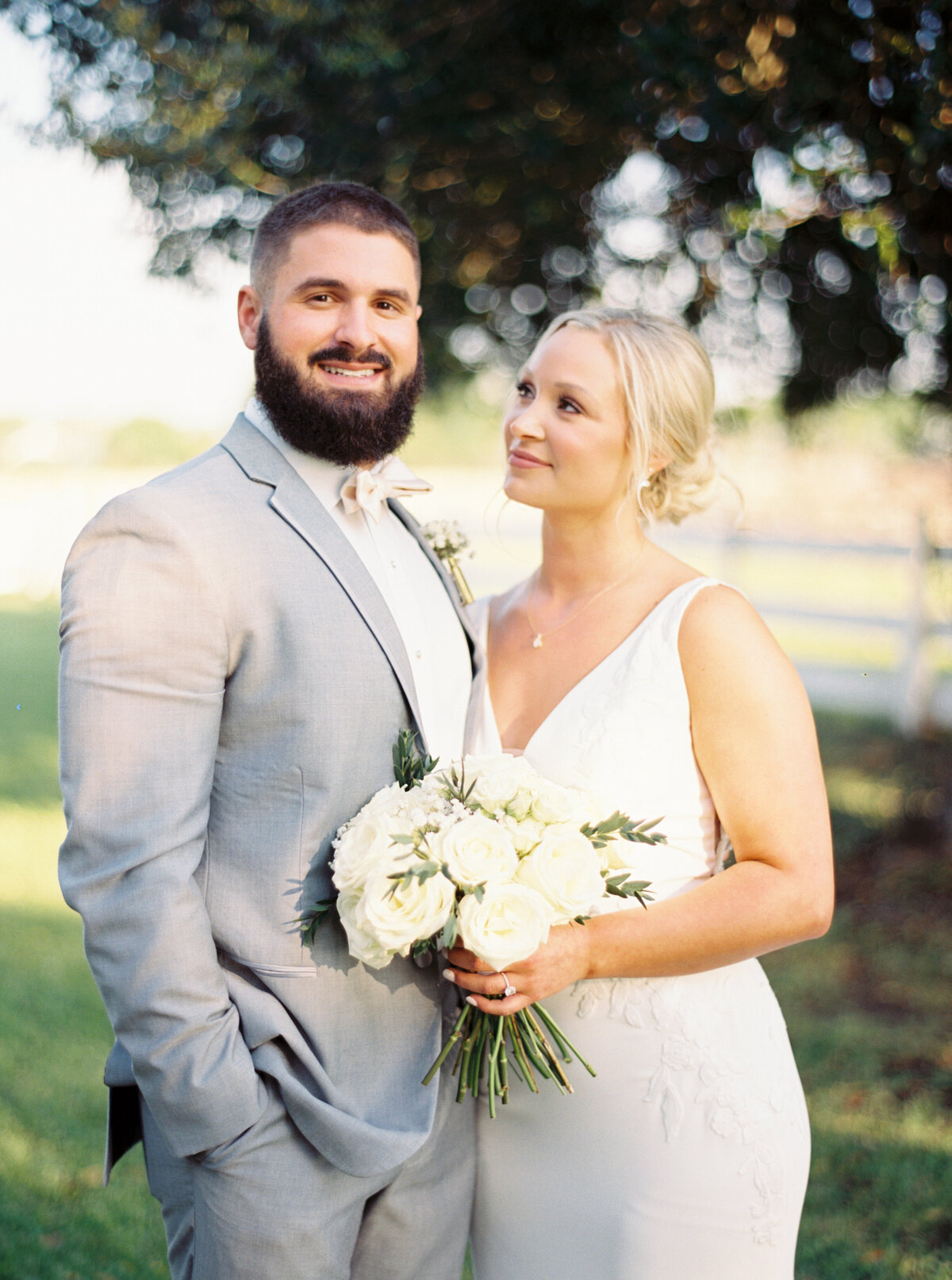 Bride and groom sharing an intimate moment on their wedding day, captured in elegant detail by Morgan Alysse, Lafayette wedding photographer.