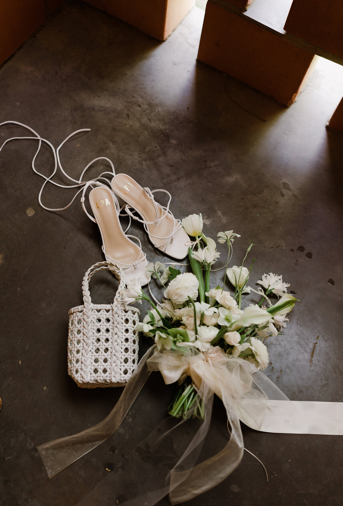 Wedding bouquet, shoes and purse at Bride having hair done at Carpenter hotel wedding