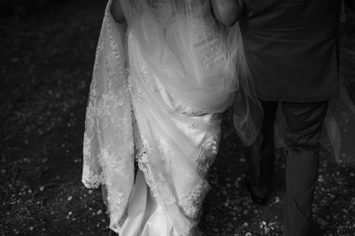 Holding her wedding dress