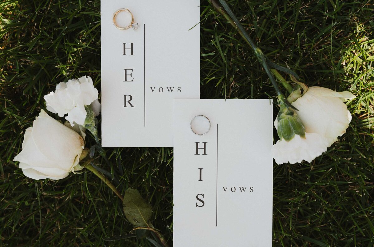 Wedding Invitations with rings and flowers laying on the ground for a Destination Wedding - Bozeman, Montana