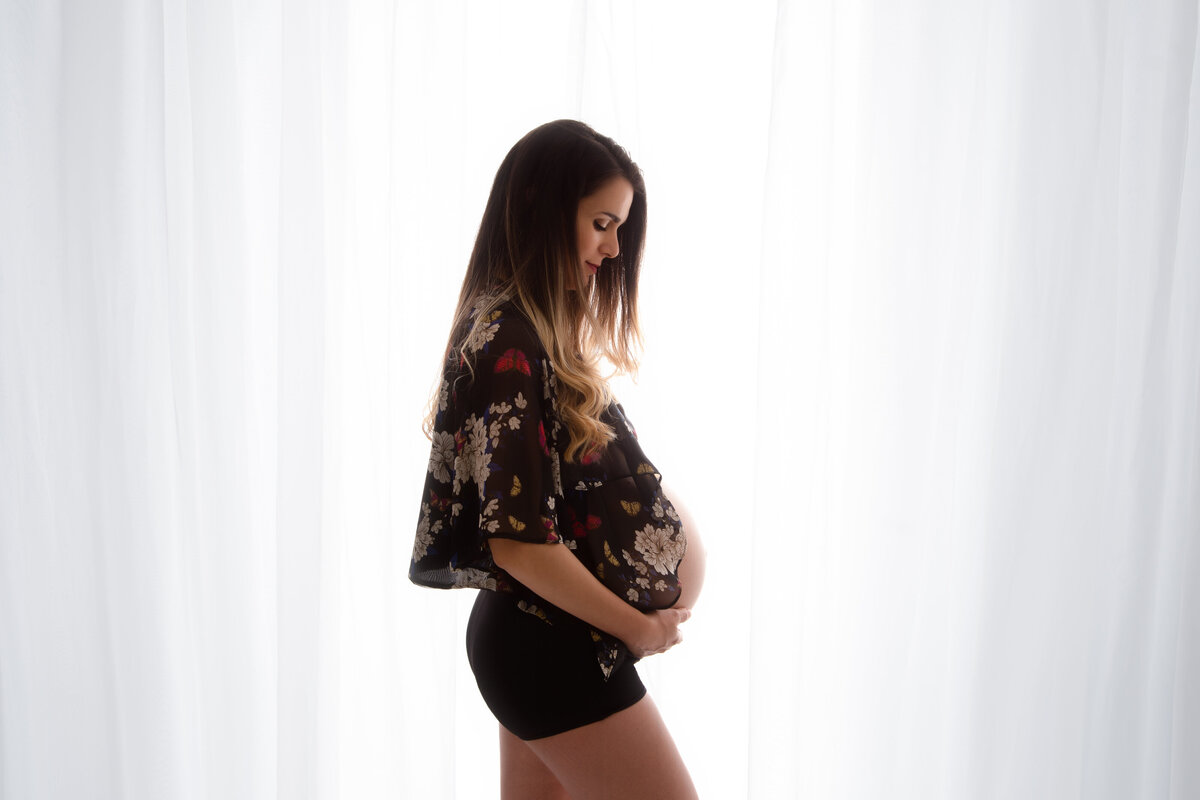 Maternity photo of mother dressed in a floral top