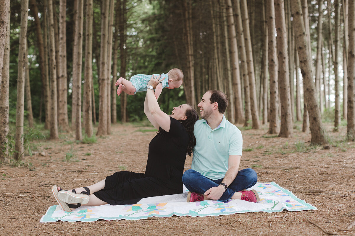 family photo session in a grove of trees