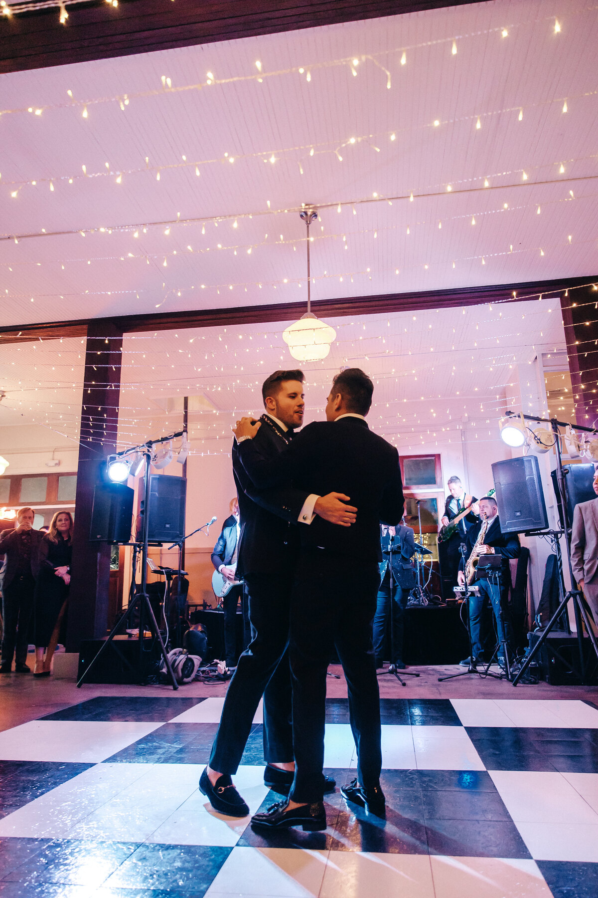 Groom's share their first dance at their wedding reception.