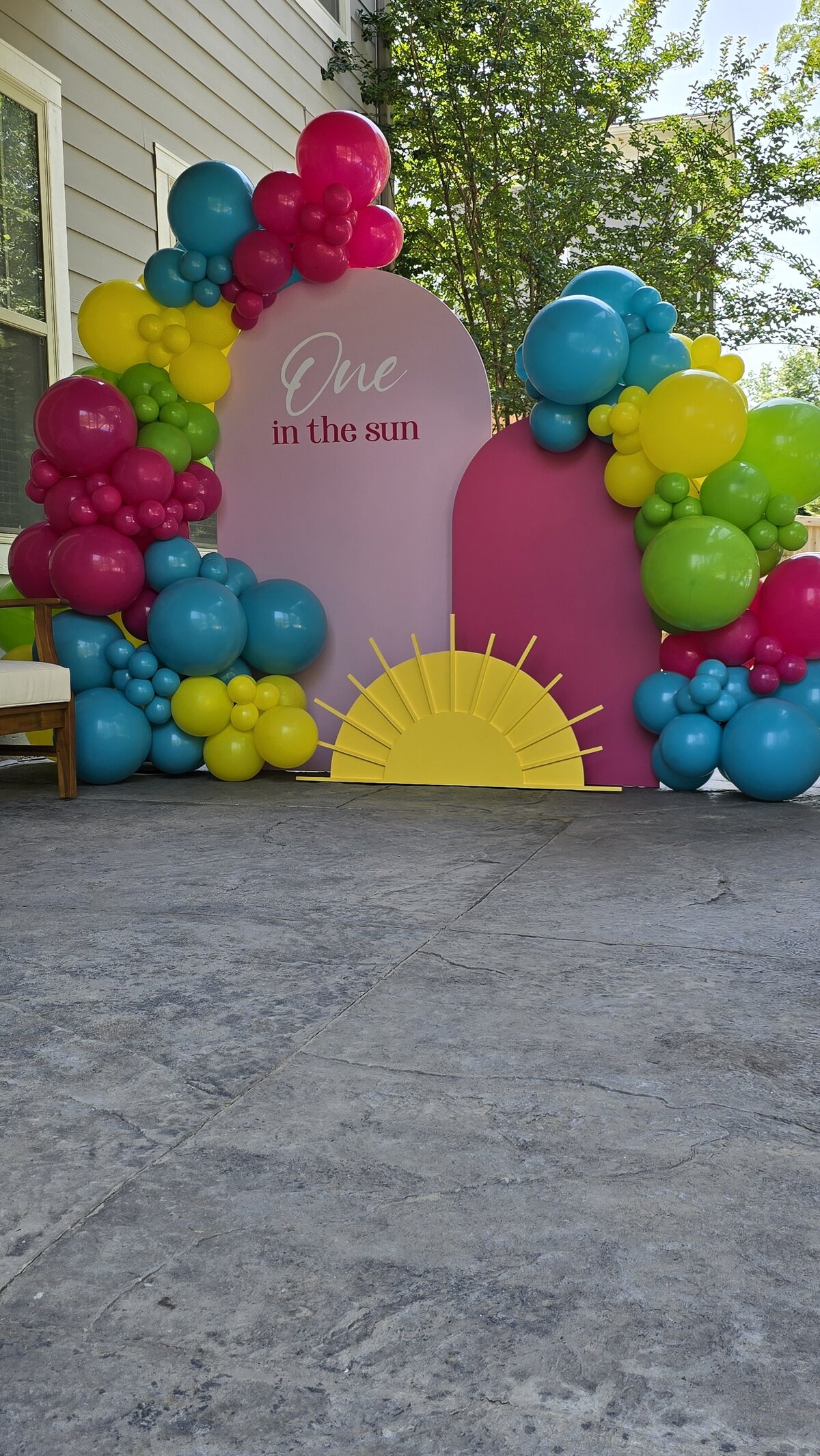 Air with Flair Decor popular balloon backdrops package in Raleigh featuring cheerful sun-themed decorations, ideal for bright and joyful event setups.