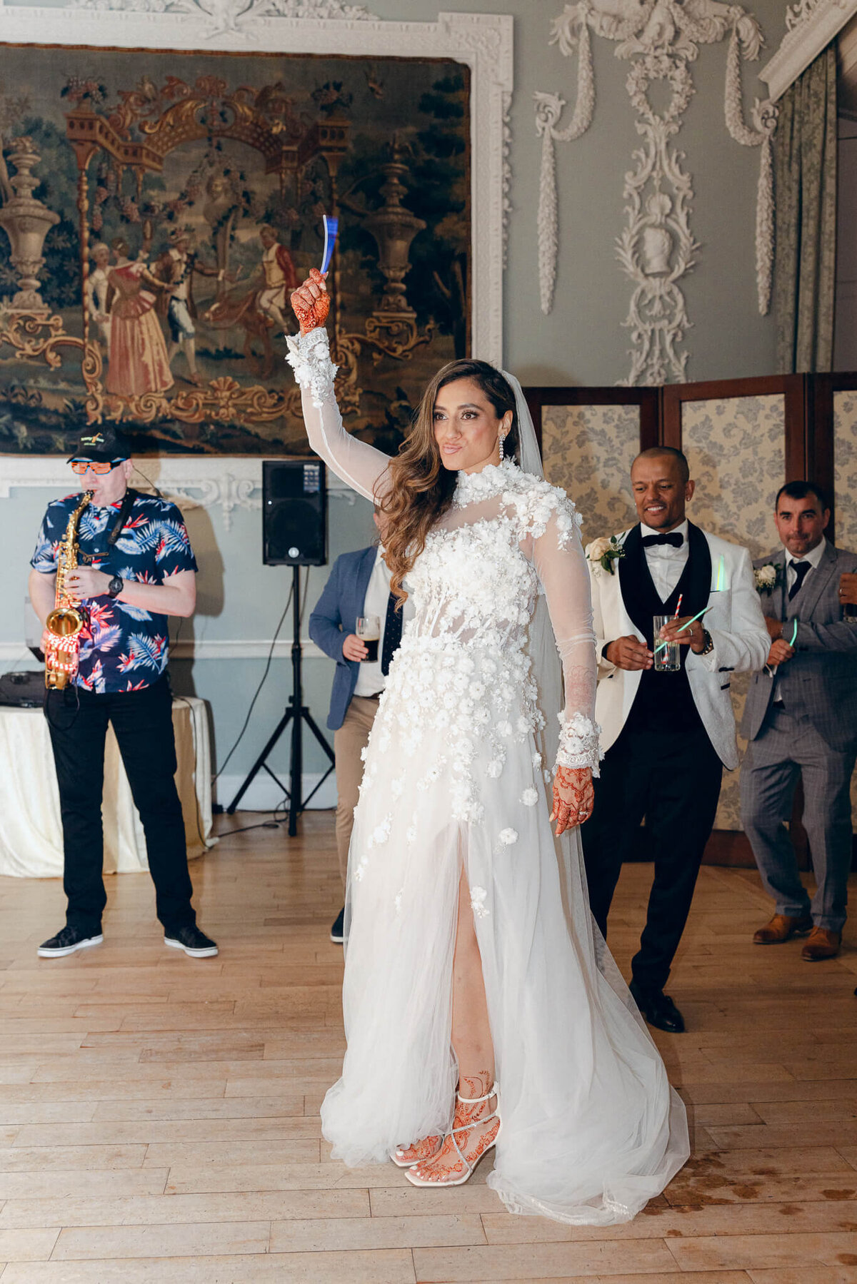A wedding photo of the bride dancing during her reception at Luttrellstown Castle