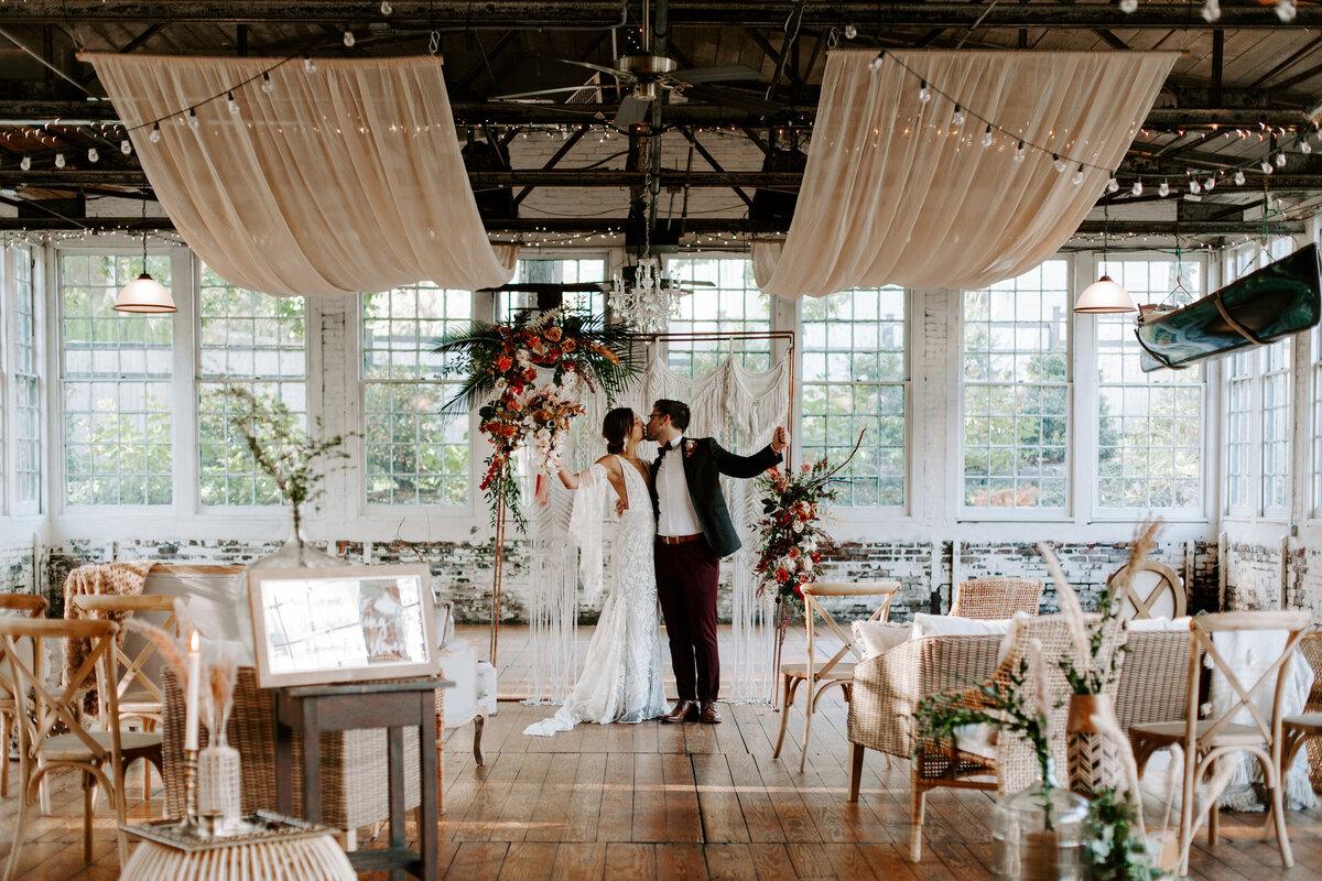 Bride and groom celebrating at the altar