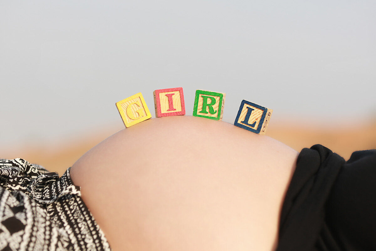 Baby blocks on pregnant tummy by Calgary Family Photographer.