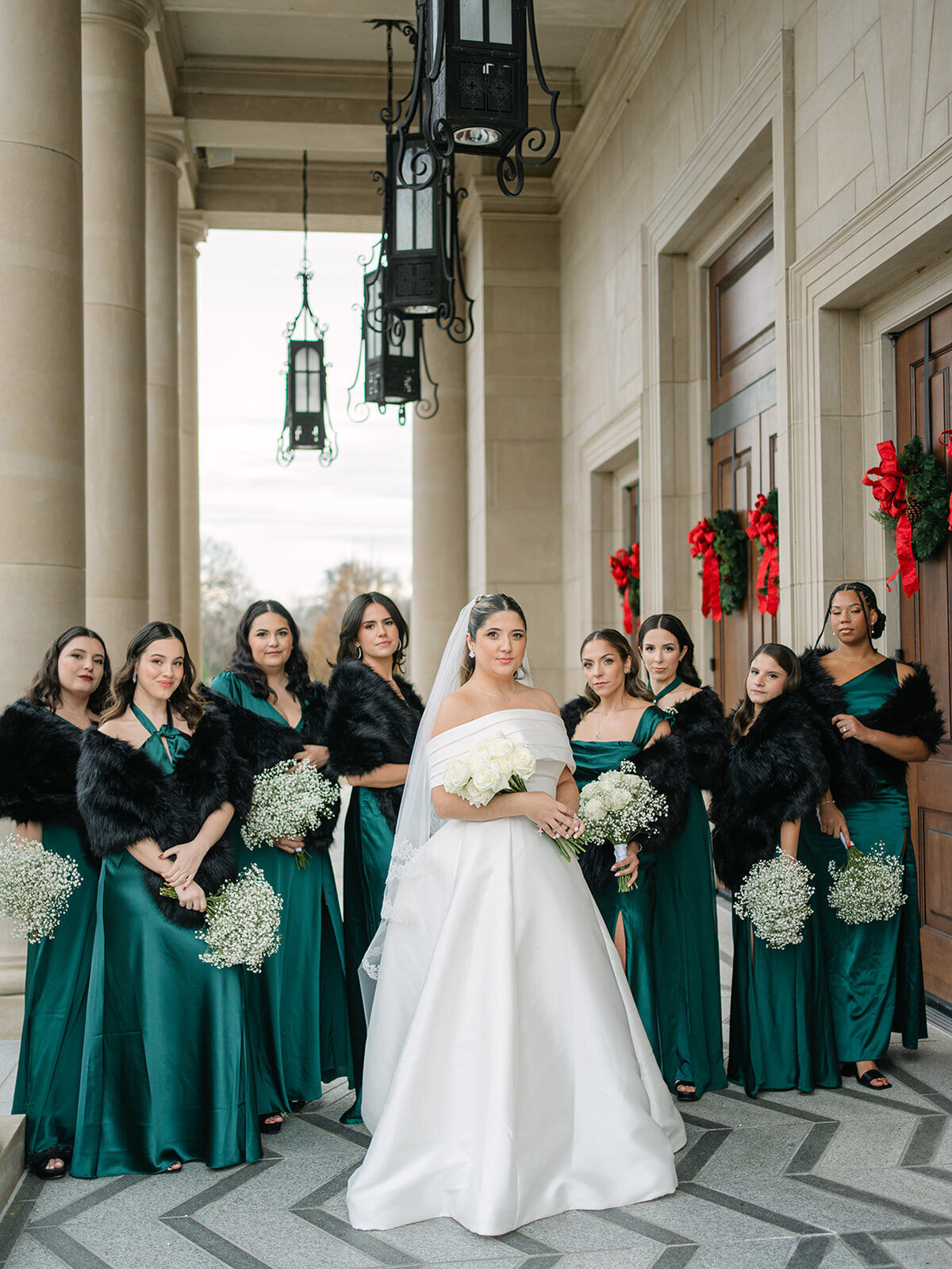 Bride and bridesmaids in green satin gowns and black shawls