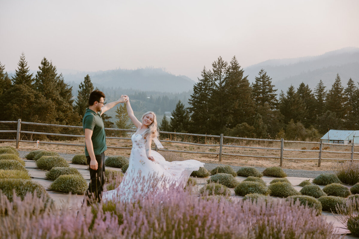 Newly engaged couple dances during their Hood River Lavender Farms engagement photo