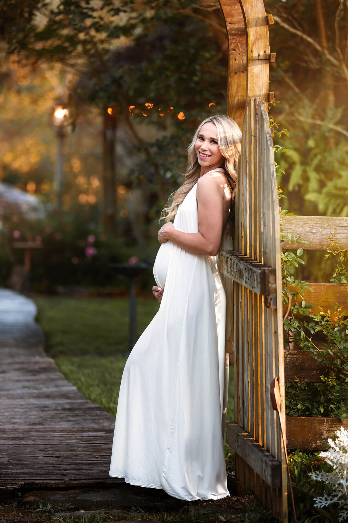 Houston Maternity Session with this gorgeous mom to be wearing a long white dress.