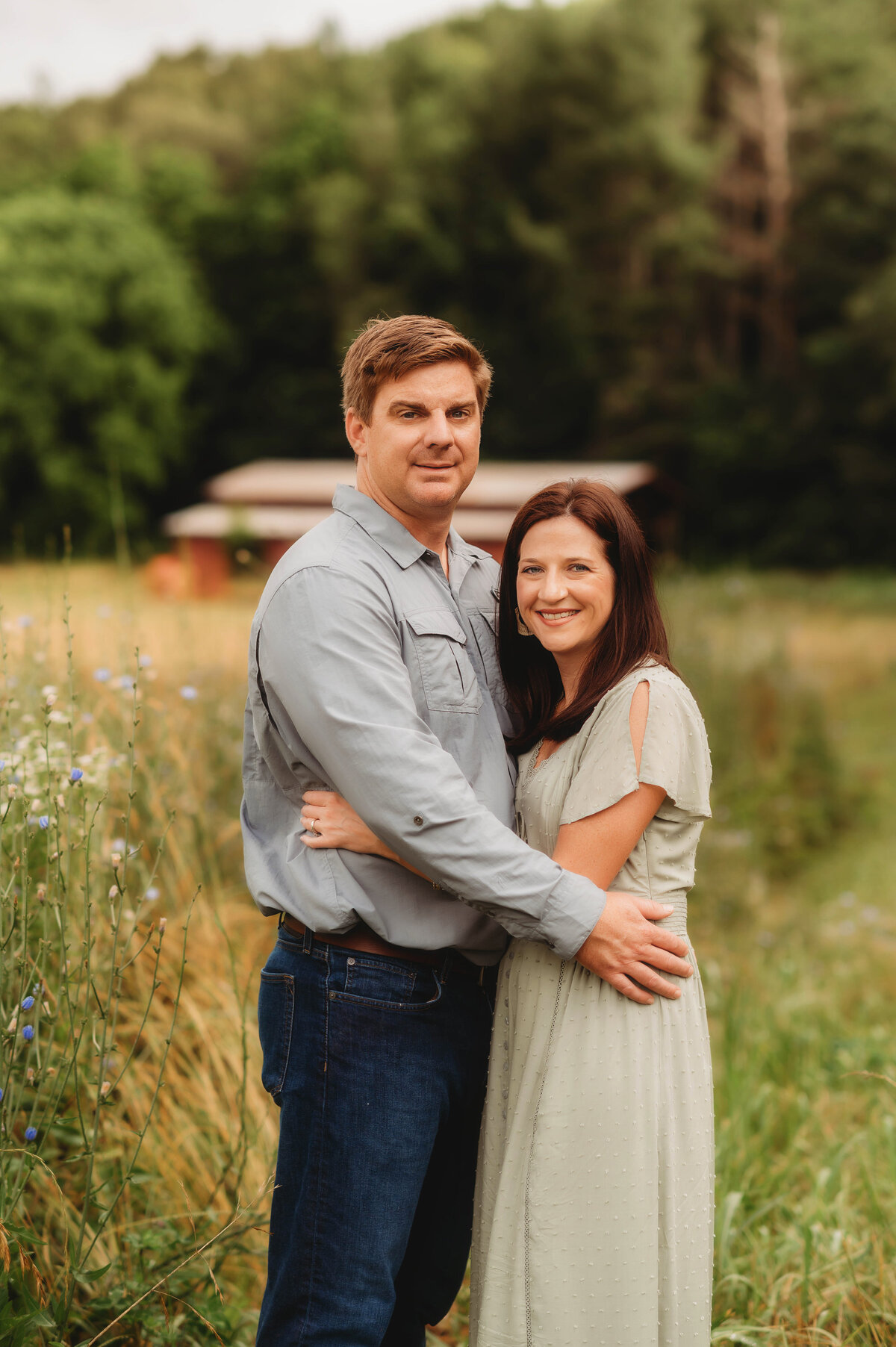 Couple poses for Portraits during an Extended Family Photoshoot in Asheville, NC.