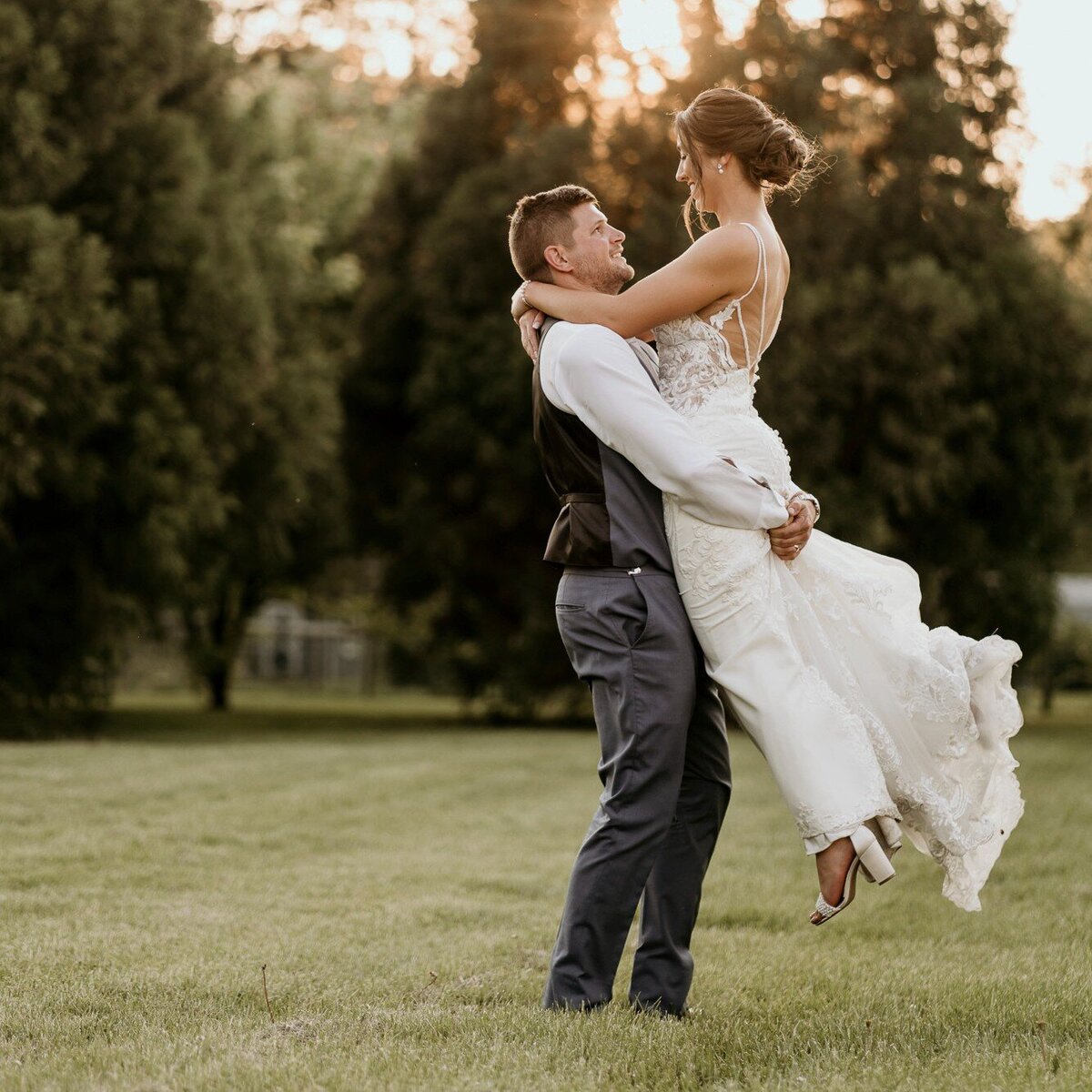 groom-picking-up-bride