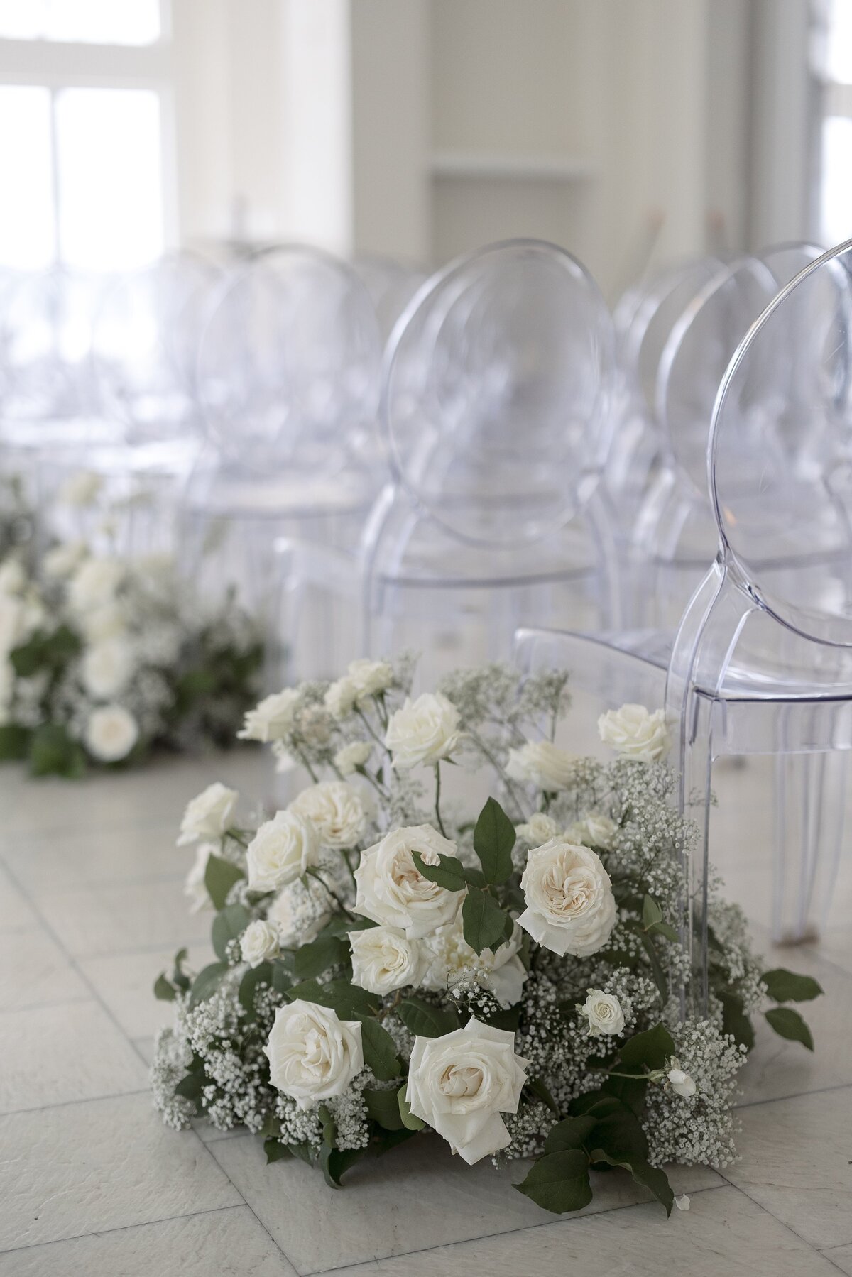 Cream floral decor by Stone Blossom.
