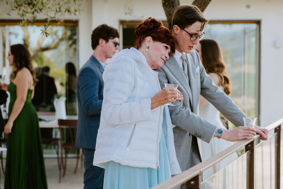 Friends celebrating with champagne on terrace