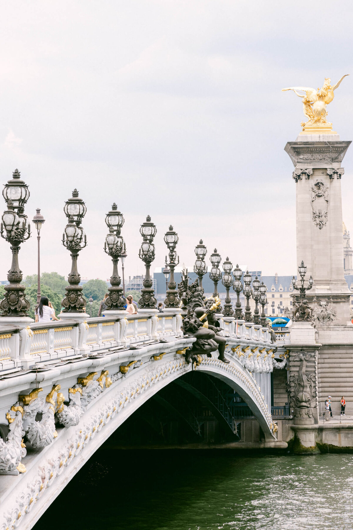 A wedding photo showing off the architecture of Paris