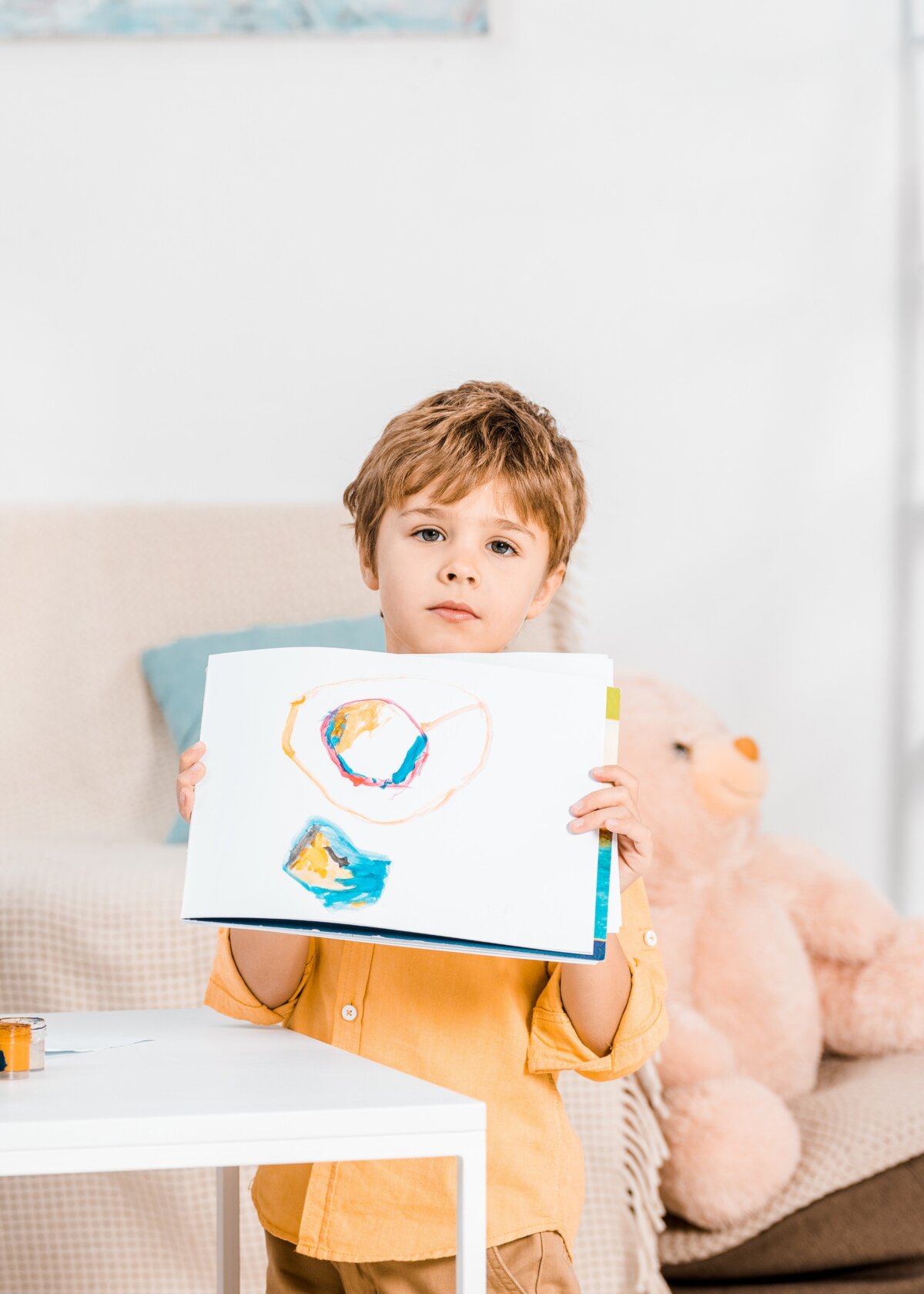 cute-little-boy-showing-picture-while-painting-wit-2024-11-10-20-22-42-utc