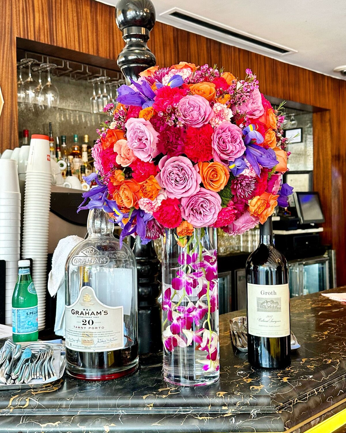 Large pink orange and purple floral arrangement