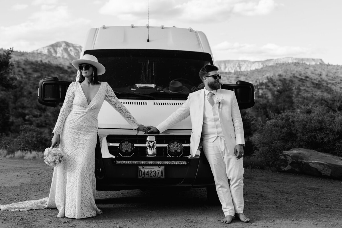 a couple standing with adventure van