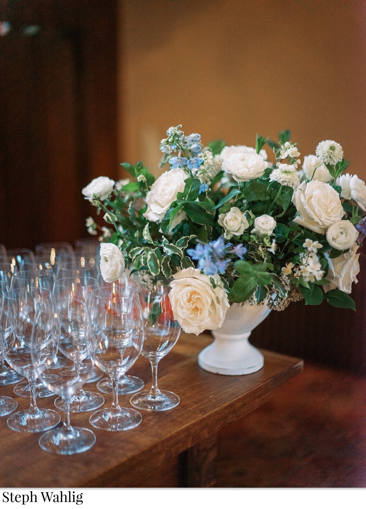 champagne, footed dish arrangement, bar flowers, blue and white flowers