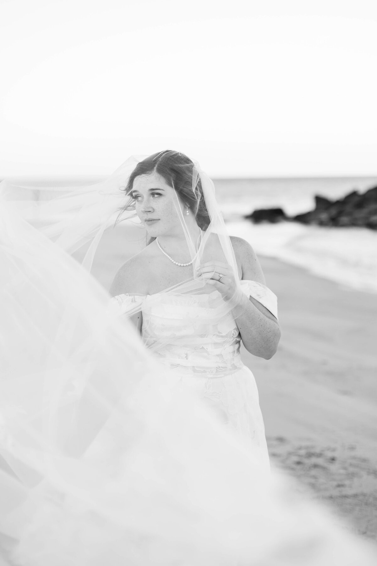 Bride in black and white shot with flowing dress