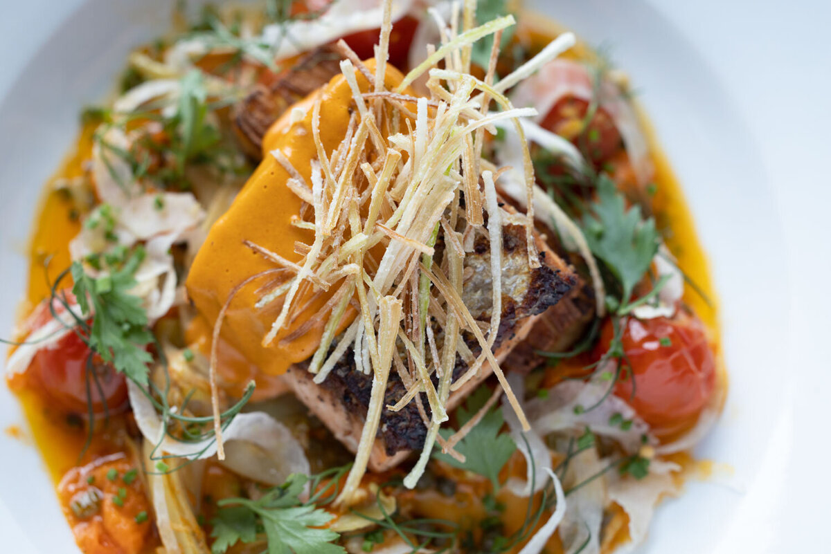 Grilled fish with crispy leeks and creamy sauce