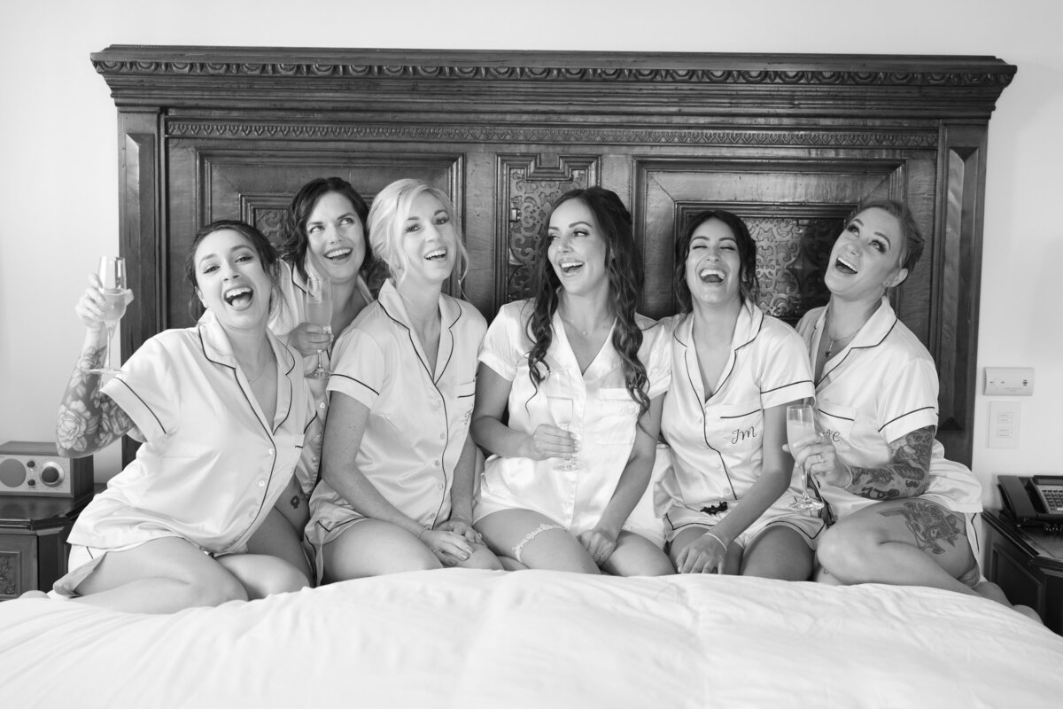 Bridesmaids sitting on the bed