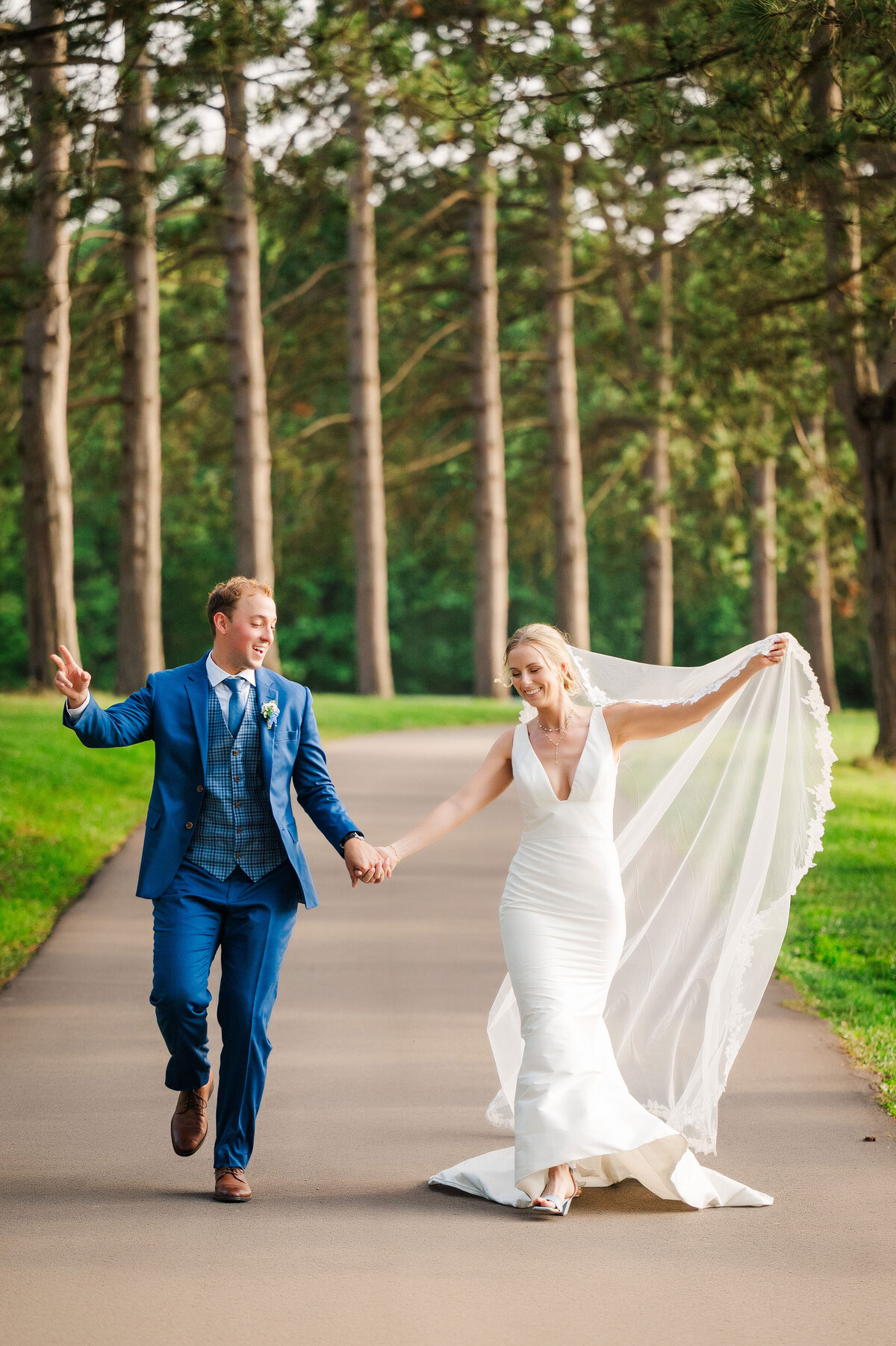 wedding photo at YMCA Camp Kon-O-Kwee main entrance road lined with tall trees