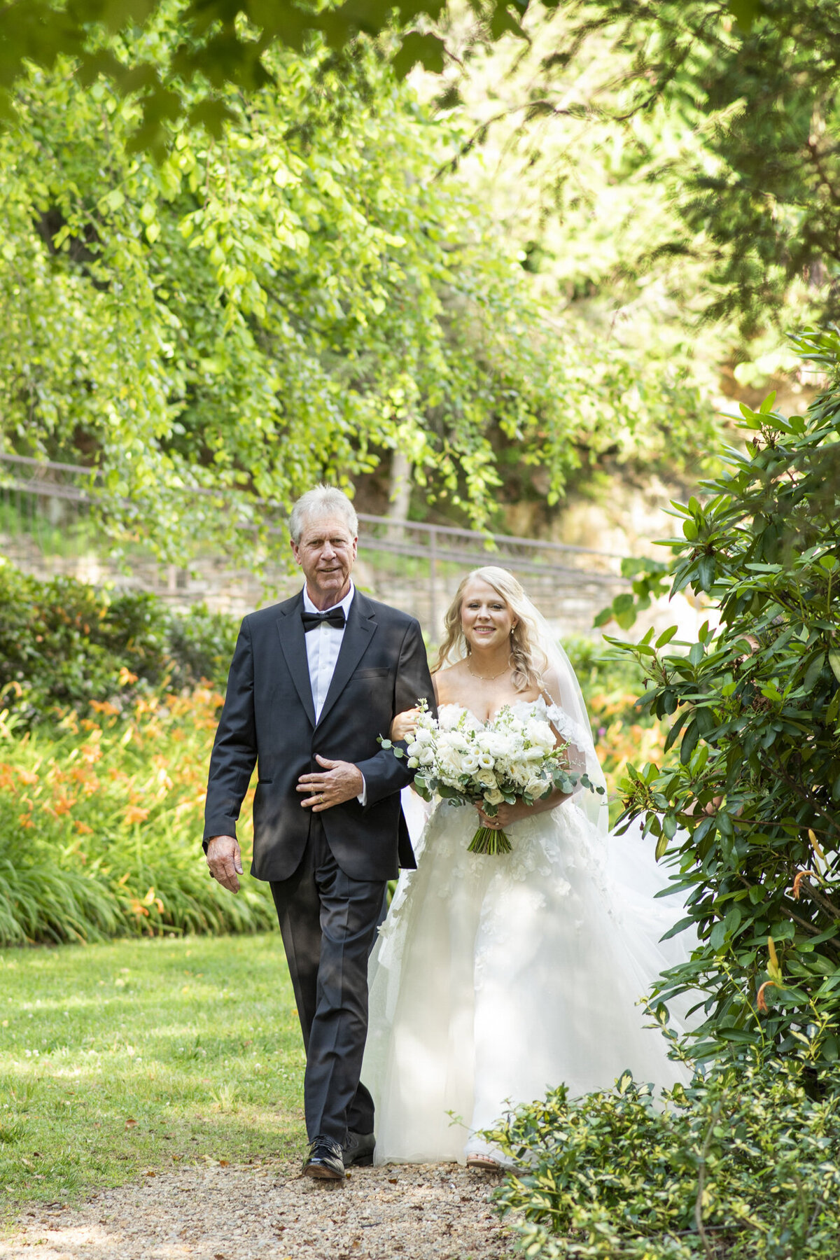 Bride and father walking down aisle