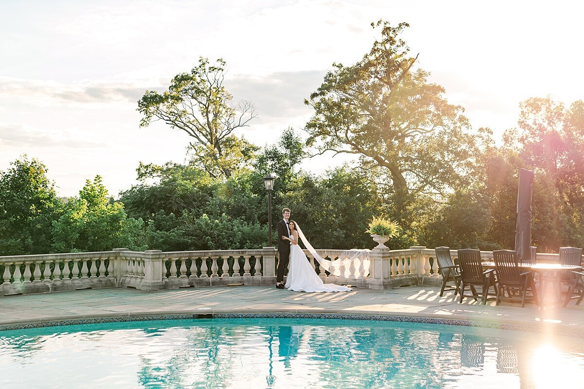 estate-at-river-run-wedding-virginia-couple-kissing-outdoor-photo-on-river-front