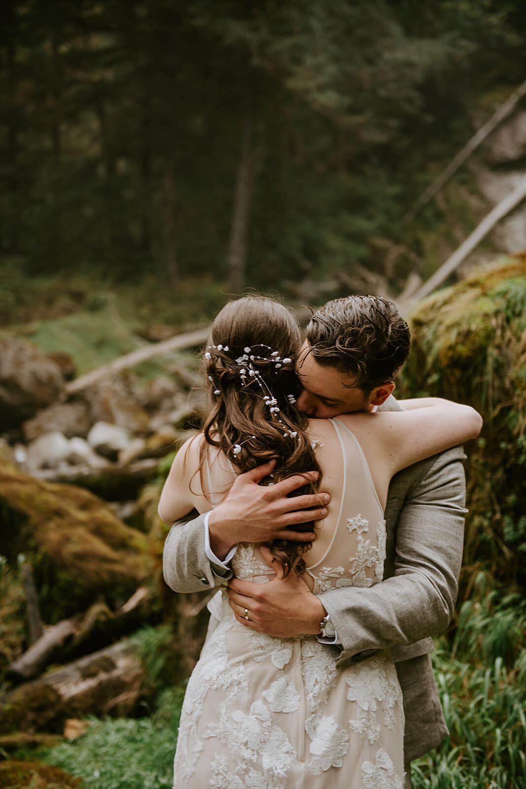 Couple during their ceremony under a waterfall during their Sunshine Coast B.C Elopement