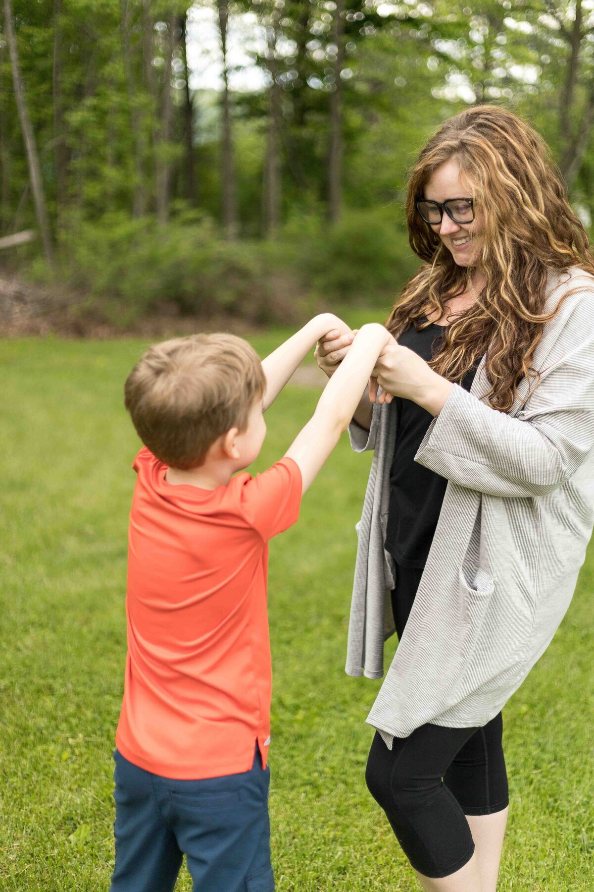 Mom and son holding hands