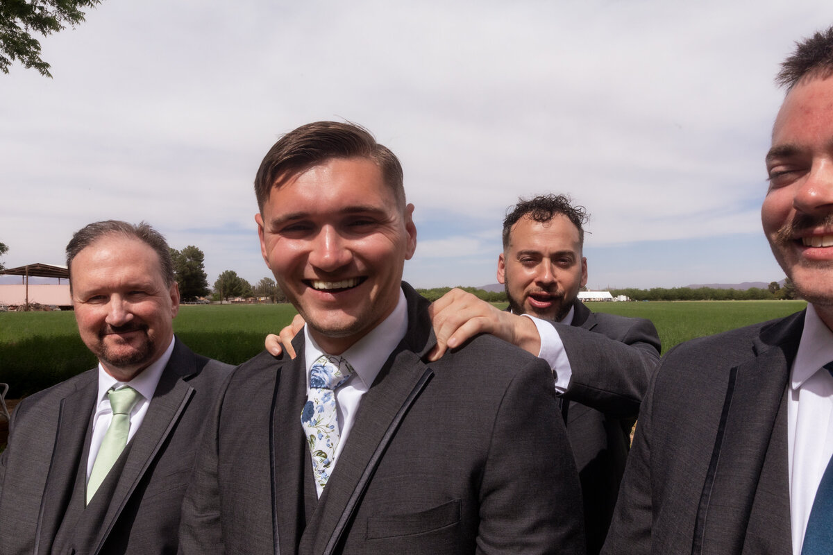 Groomsmen posing together during a Utah wedding, captured by Lamblight Photography