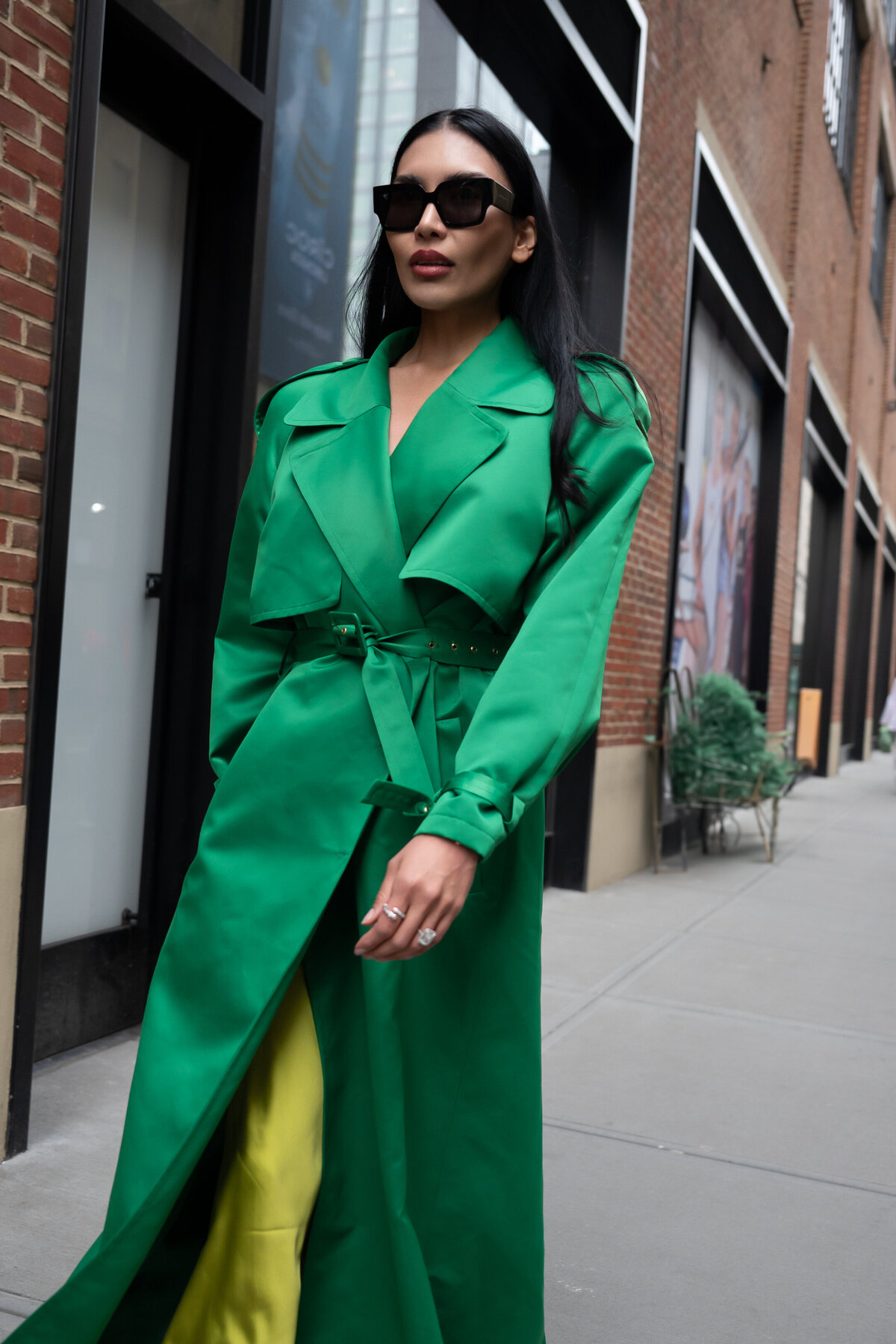 woman in green trench coat