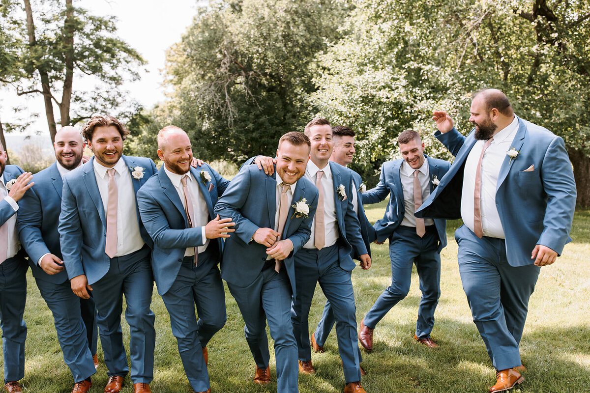 groomsmen outdoor portrait in blue suits and blue ties
