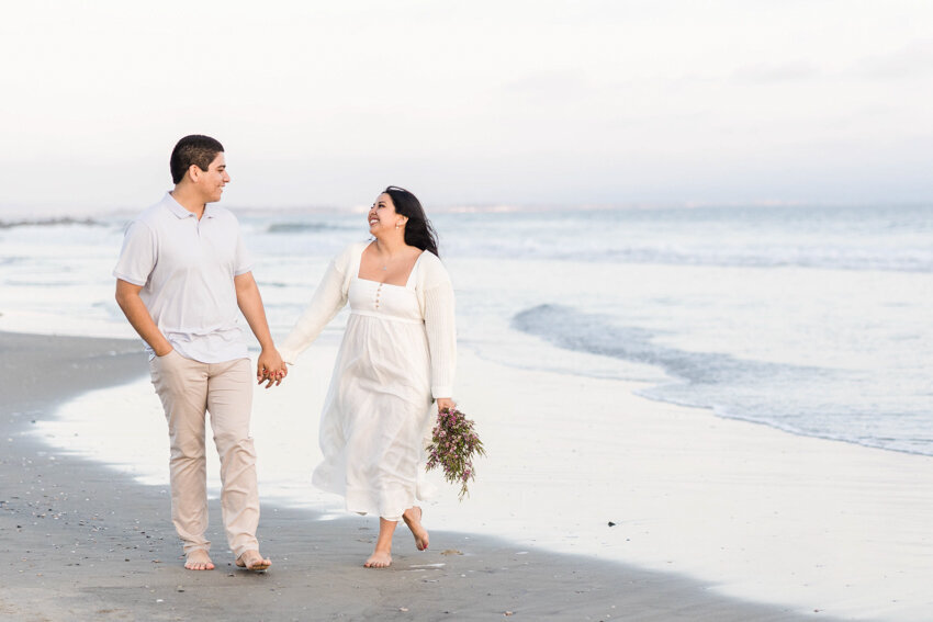 engaged-couple-walking-on-Coronado-San-Diego