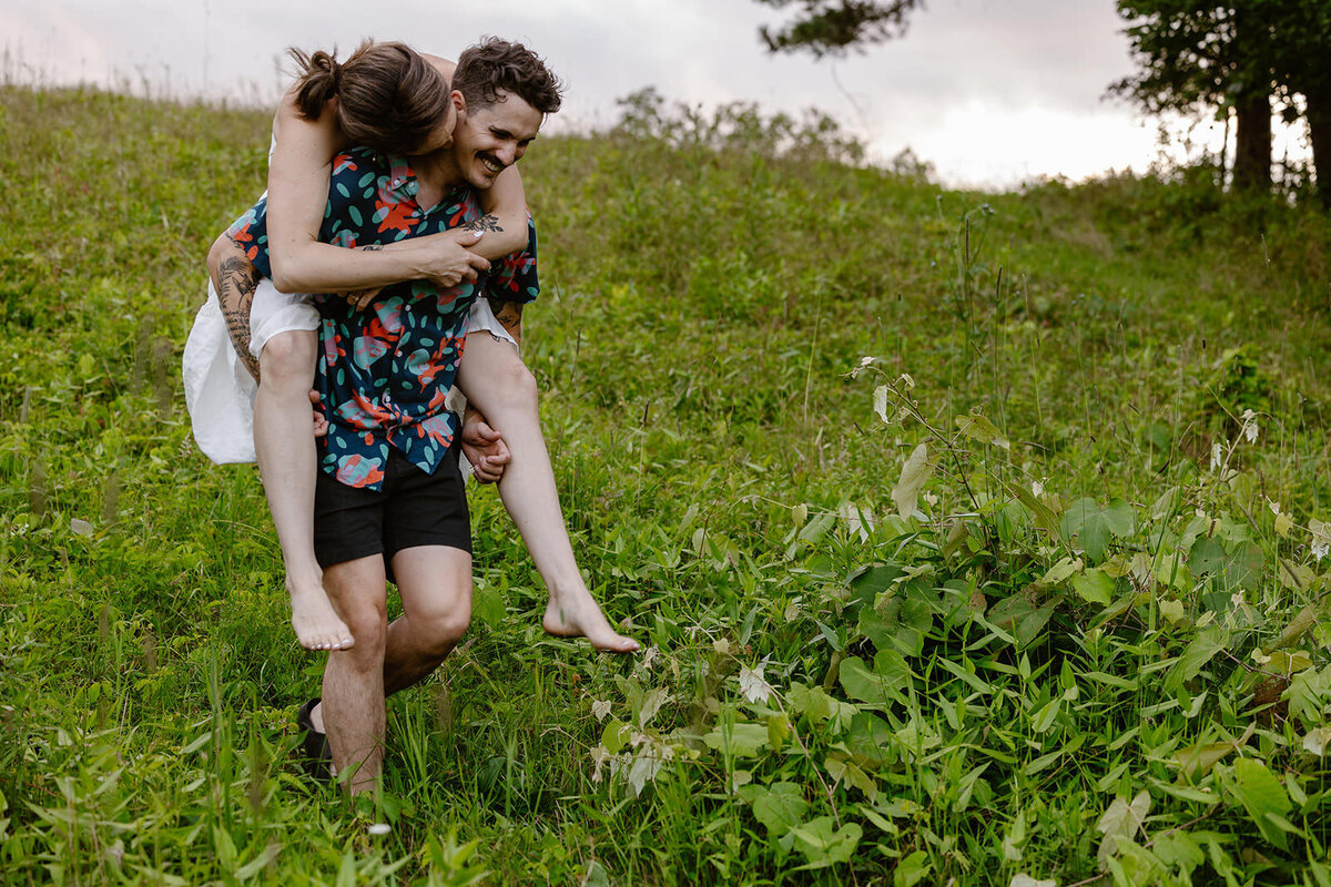 A person carrying their partner on their back
