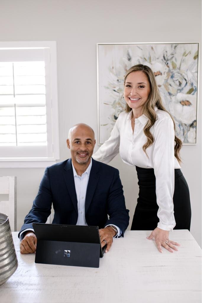 Charlene and Damian in a professional setting, ideal for brand photoshoots focusing on teamwork, tech environments, and effective communication.