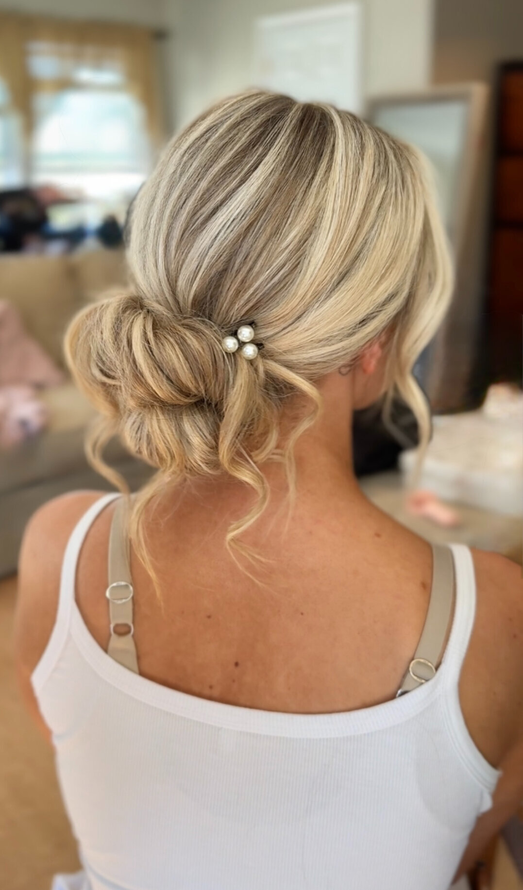 classic bridal updo low bun on blonde hair. destination bridal hair stylist