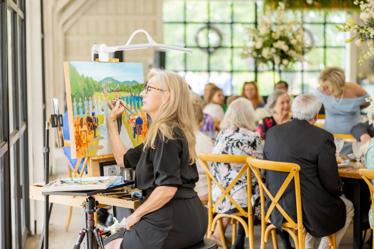 Art by Diane working on her commissioned live painting of the wedding ceremony. 