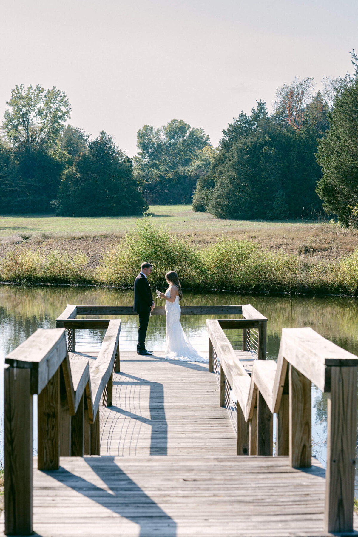 A wedding photo of a bride and groom during their first look