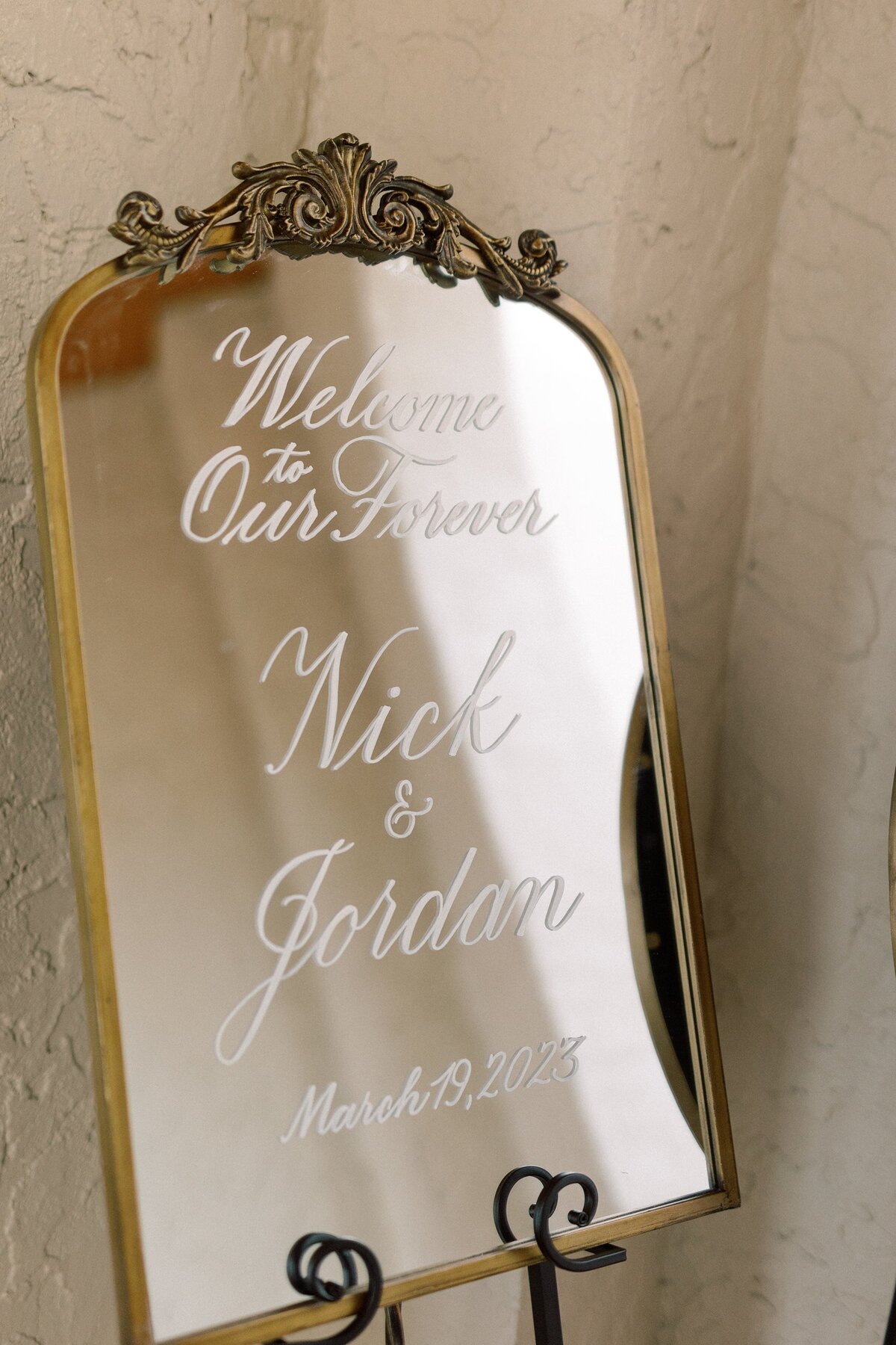 Medium arch mirror with ornate ornament on top with calligraphy for welcome sign