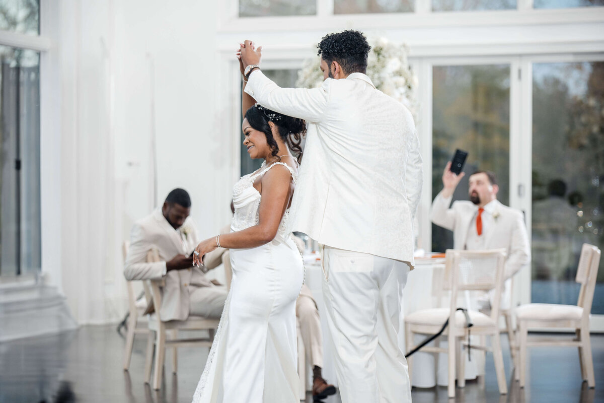 The newlyweds twirl and dance with excitement on their wedding night.