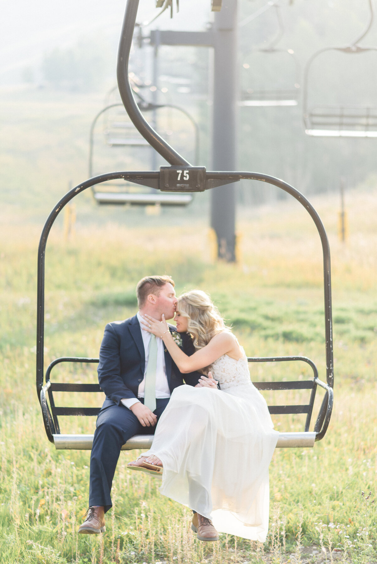 Summer Granby Wedding, bride & groom portraits on chairlift