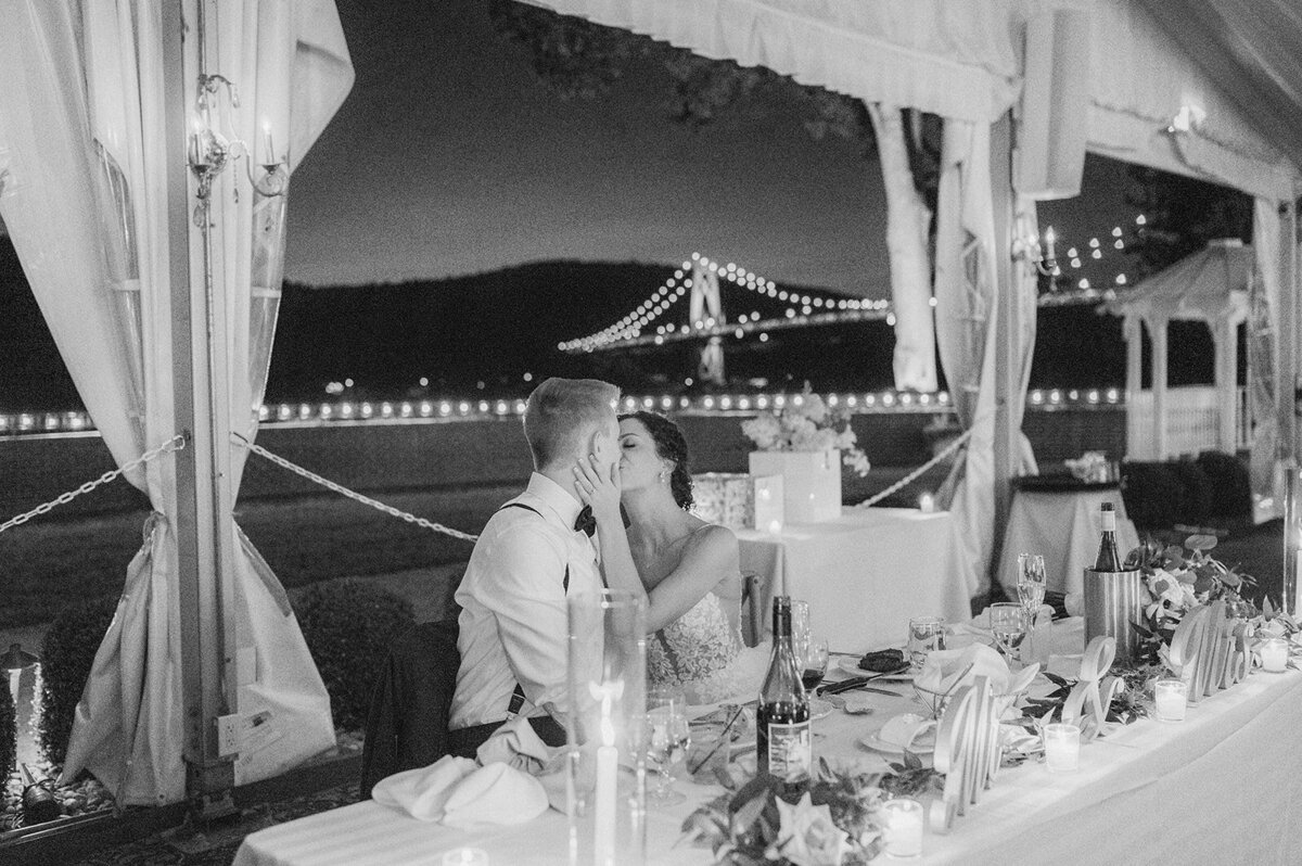 couple kiss during reception
