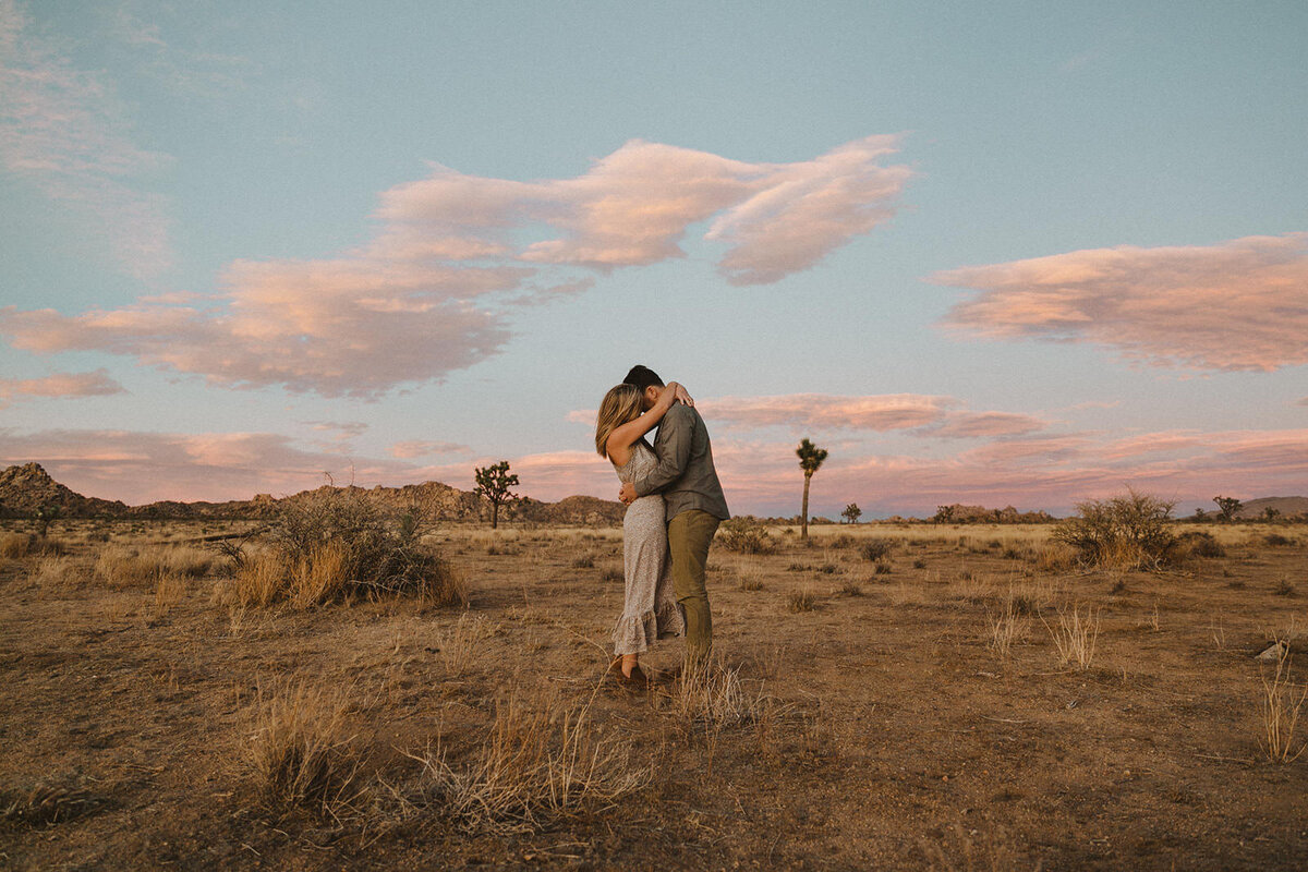 couple embracing in desert