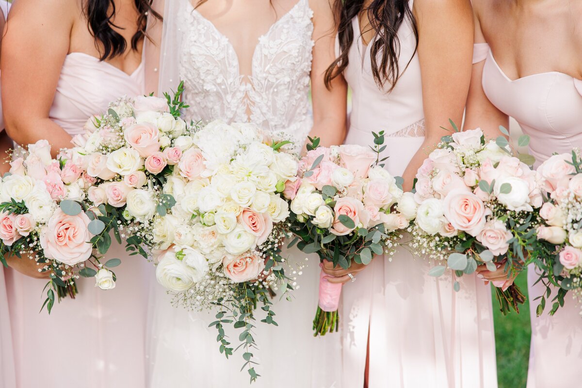 Close up of bride and bridesmaids holding bouquets during a Boston wedding