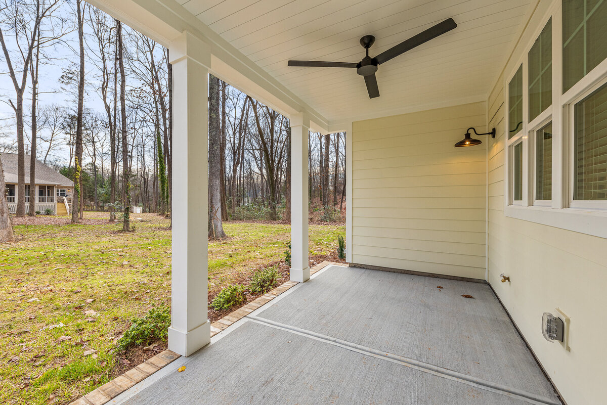 covered back porch with tongue and groove ceiling and ceiling fan