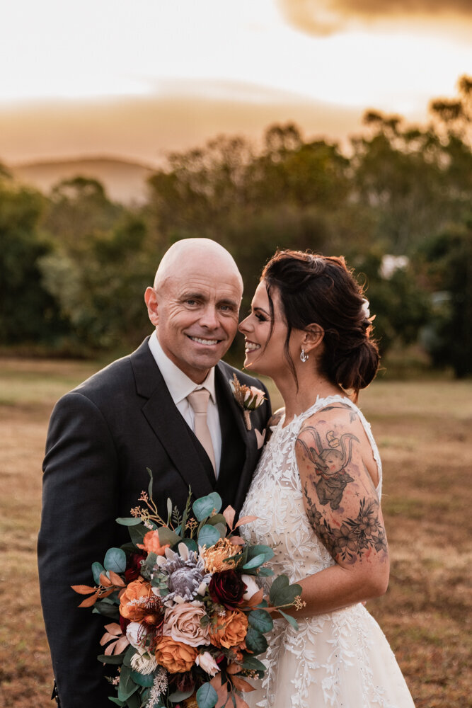 bride and groom embracing at sunset - Townsville Wedding Photography by Jamie Simmons