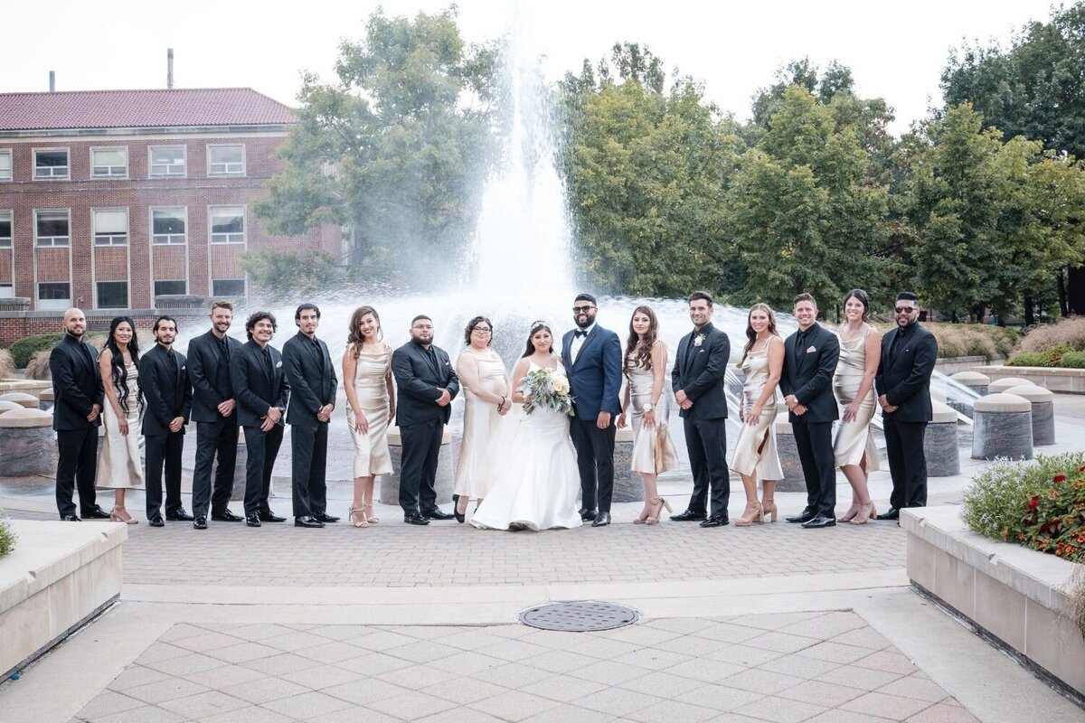 Wedding party lined up in front of Purdue's Union fountain