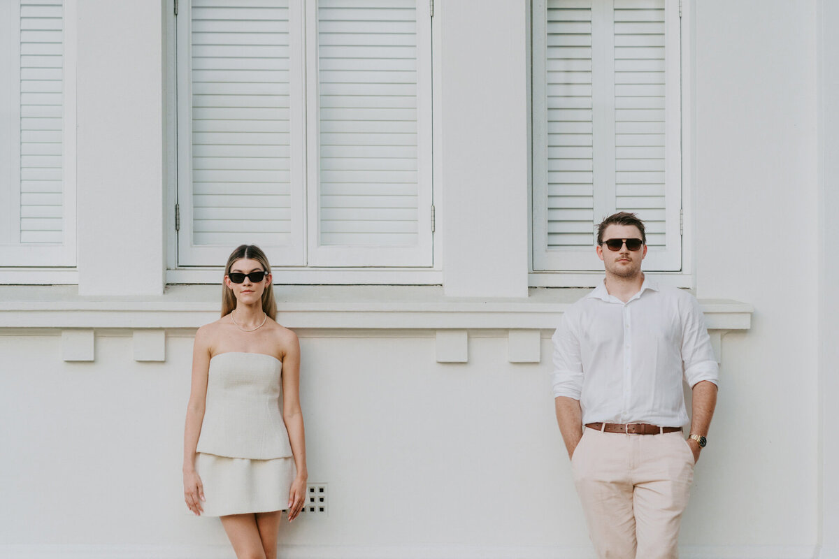engaged couple in front of old building